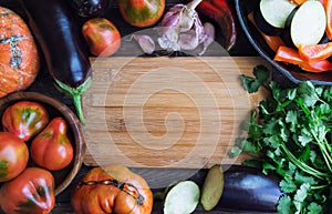 Fresh organic vegtables on rustic wooden background photo