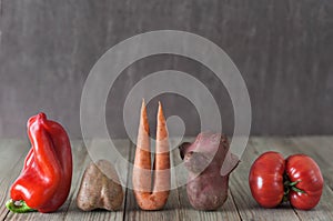 Vegetables on wooden  background.Ugly food