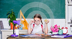 Vegetarian. back to school. Einstein. digital age with modern technology. small girl ready to eat apple. Smart child