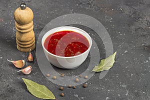 Vegetarian borsch in a bowl. Plate of beetroot soup on a black background. Traditional Ukraine Russian food cuisine. The concept