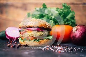 Vegetarian burger home made burger with chickpea cutlet and vegetables. Veg concept. Copy space