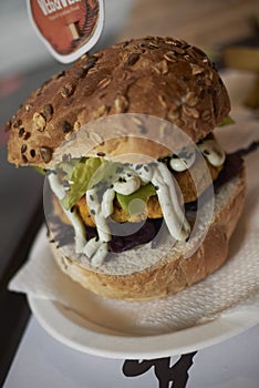 Vegetarian burger with red cabbage and lime mayo