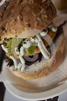 Vegetarian burger with red cabbage and lime mayo