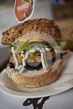 Vegetarian burger with red cabbage and lime mayo