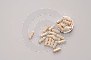 Vegetarian capsules laid on white table isolated