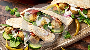 Vegetarian Chickpea falafel pita bread with pickled chilies and fresh salad. healthy vegan food.