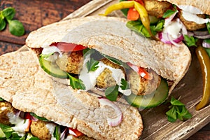 Vegetarian Chickpea falafel pita bread with pickled chilies and fresh salad. healthy vegan food.