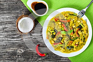 vegetarian curry with zucchini, eggplants, carrots, bell pepper, chickpeas, top-view