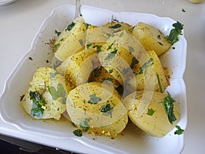 Vegetarian dish with potatoes and spices served on a plate