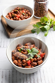 Vegetarian dish of stewed pink beans and tomatoes. A delicious bean dish served