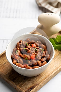 Vegetarian dish of stewed pink beans and tomatoes. A delicious bean dish served