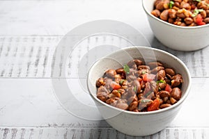 Vegetarian dish of stewed pink beans and tomatoes. A delicious bean dish served