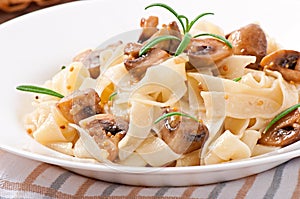 Vegetarian dish with tagliatelle and mushrooms