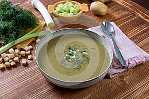 vegetarian food green soup cream on wooden table