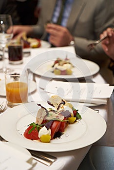 Vegetarian food with marinated tomatoes, arugula, mozzarella che