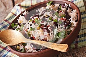 Vegetarian food: rice with red beans in a bowl close-up. horizon
