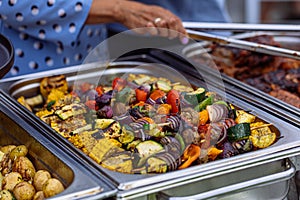 Vegetarian food self-service, served in metal trays