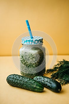 Vegetarian green mix of vegetable and fruit cocktail from cucumber and green parsley and dill