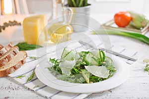 Vegetarian Green salad with Parmesan arugula avocado nuts