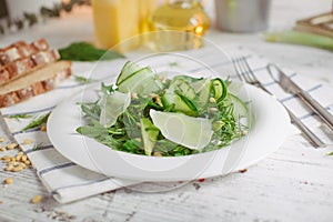 Vegetarian Green salad with Parmesan arugula avocado nuts