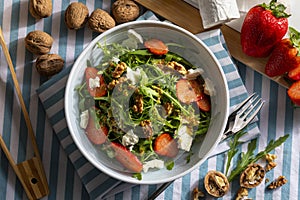 Vegetarian and healthy salad of green, natural, raw and freshly cut arugula rÃºgula sprouts and leaves brassicaceae, with