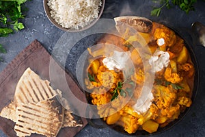 Vegetarian indian food Cauliflower curry basmati rice naan bread Healthy food photo