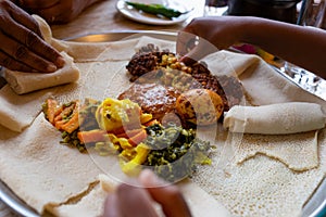 Vegetarian Injera meal with shiro, lentils and egg