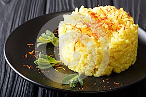 Vegetarian Italian food: risotto with saffron and mint Risotto