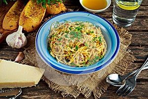 Vegetarian Italian Pasta Spaghetti Aglio E Olio with garlic bread, red chili flake, parsley, parmesan cheese and glas of