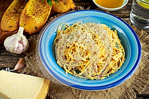 Vegetarian Italian Pasta Spaghetti Aglio E Olio with garlic bread, red chili flake, parsley, parmesan cheese and glas of