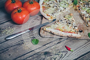 Vegetarian italian pizza on wodden table.