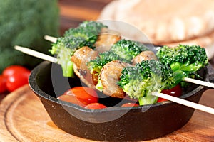 Vegetarian kebabs with seitan and broccoli on a skewers.