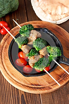 Vegetarian kebabs with seitan and broccoli on a skewers