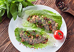 Vegetarian lettuce wraps with mushrooms, chestnuts, onion