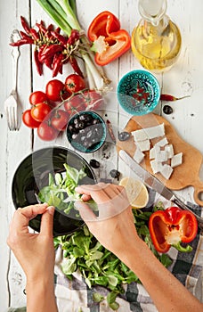 Vegetarian low calorie Greek salad preparation top view