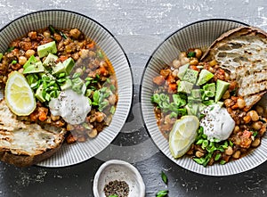 Vegetarian mushrooms chickpea chili on a gray background, top view. Healthy vegetarian food