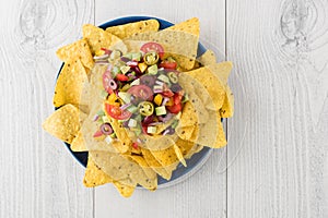 Vegetarian nachos with salsa and sour cream dips