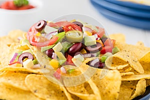 Vegetarian nachos with salsa and sour cream dips