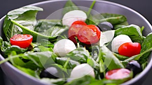 Vegetarian and, organic food concept. Cherry tomato and mozzarella falling down in fresh salad