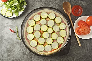 Vegetarian pizza. Cooking process of vegetable homemade pizza with fresh ingredients isolated on dark background. Copy space. Step