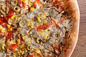 Vegetarian pizza on rustic board, fast food