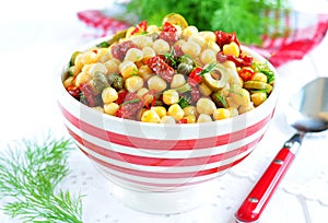 Vegetarian salad with chickpeas, dried tomatoes, capers and dill