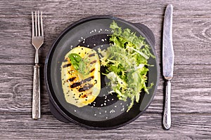 Vegetarian salad with grilled mango, fresh frisee and sesame