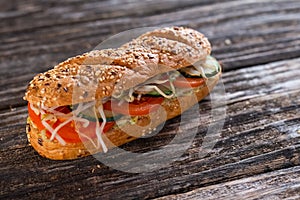 Vegetarian sandwich with tomato, cucumber and sprouts