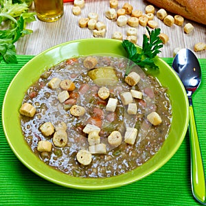 Vegetarian soup with toast in a dish