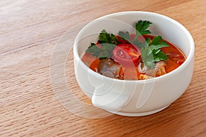 Vegetarian soup Tom Yam with coconut milk, mushrooms and cherry tomatoes