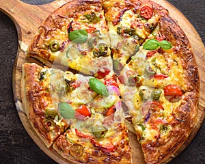 Vegetarian cheese pizza on round pizza stone photo