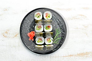 Vegetarian sushi with avocado and tomatoes.