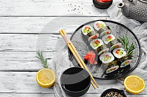 Vegetarian sushi with avocado and tomatoes.