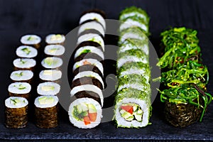Vegetarian sushi menu. Rolls with cucumber, futomaki with vegeta